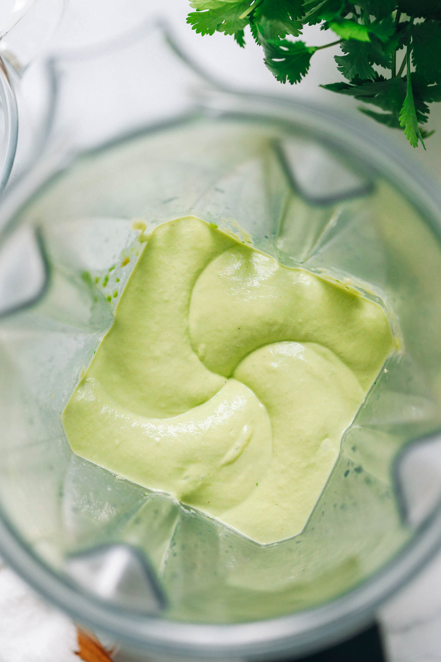 Smooth and creamy avocado crema in a blender
