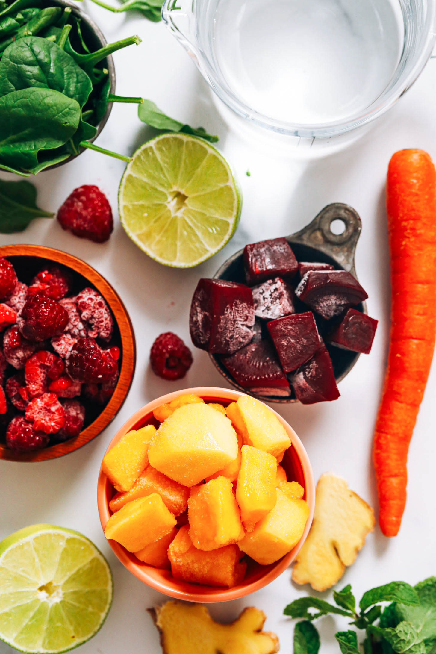 Water, spinach, lime, raspberries, beets, mango, ginger, carrot, and mint