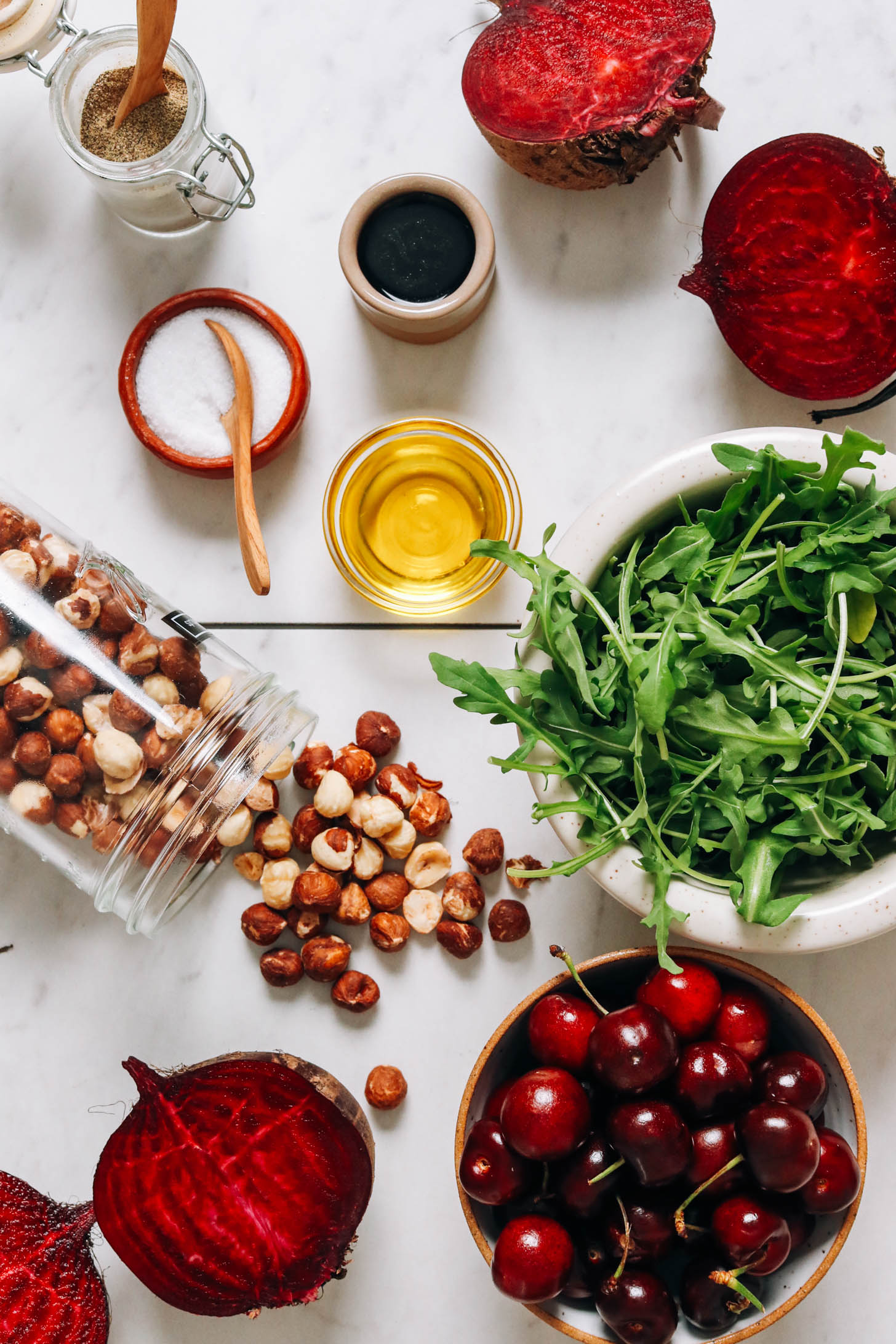 Beets, arugula, cherries, hazelnuts, olive oil, salt, pepper, and balsamic vinegar