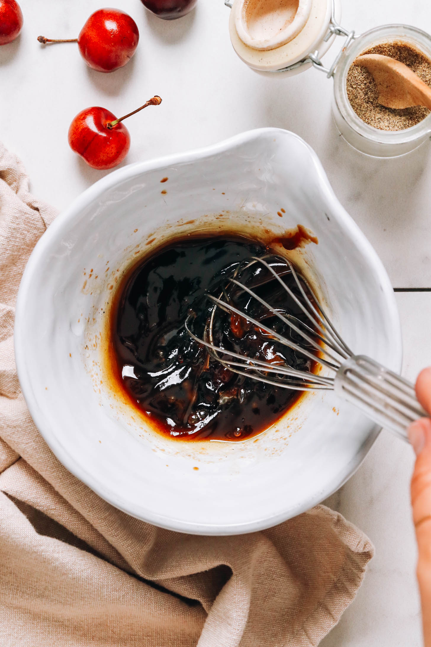 Whisking a balsamic vinaigrette dressing in a bowl