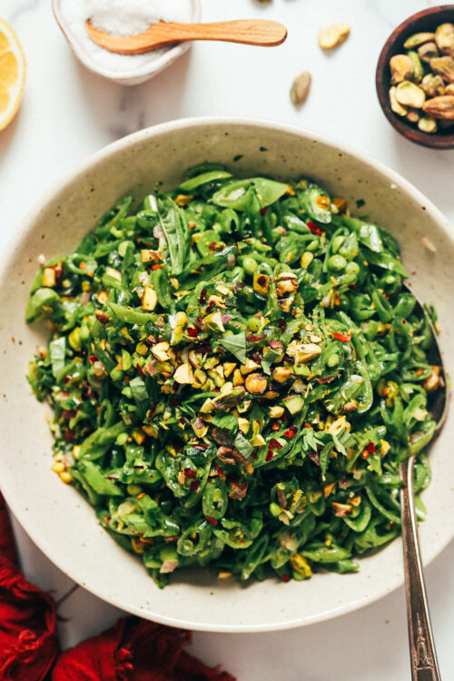 Serving plate piled high with snap pea salad