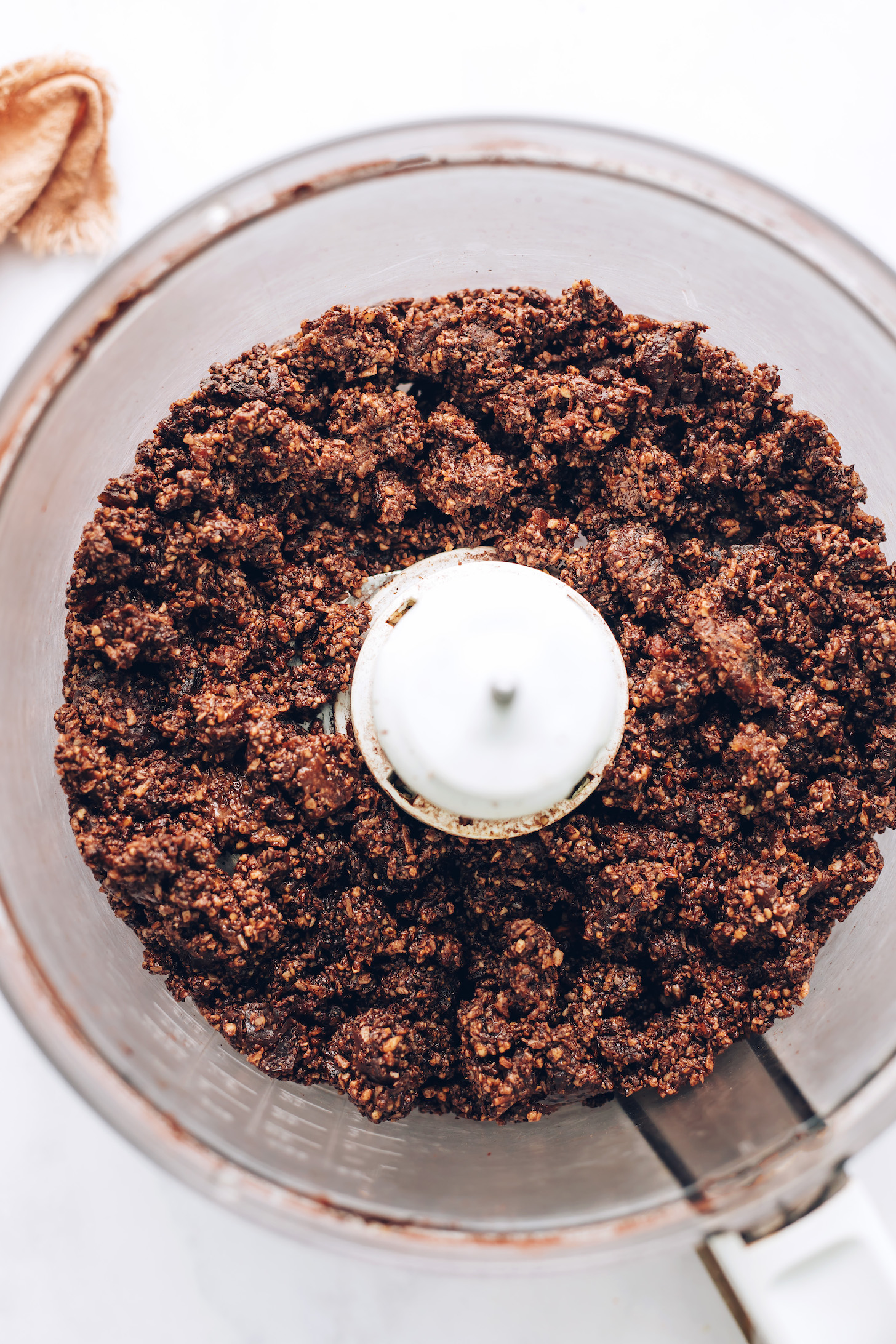 Chocolate energy bite dough in a food processor