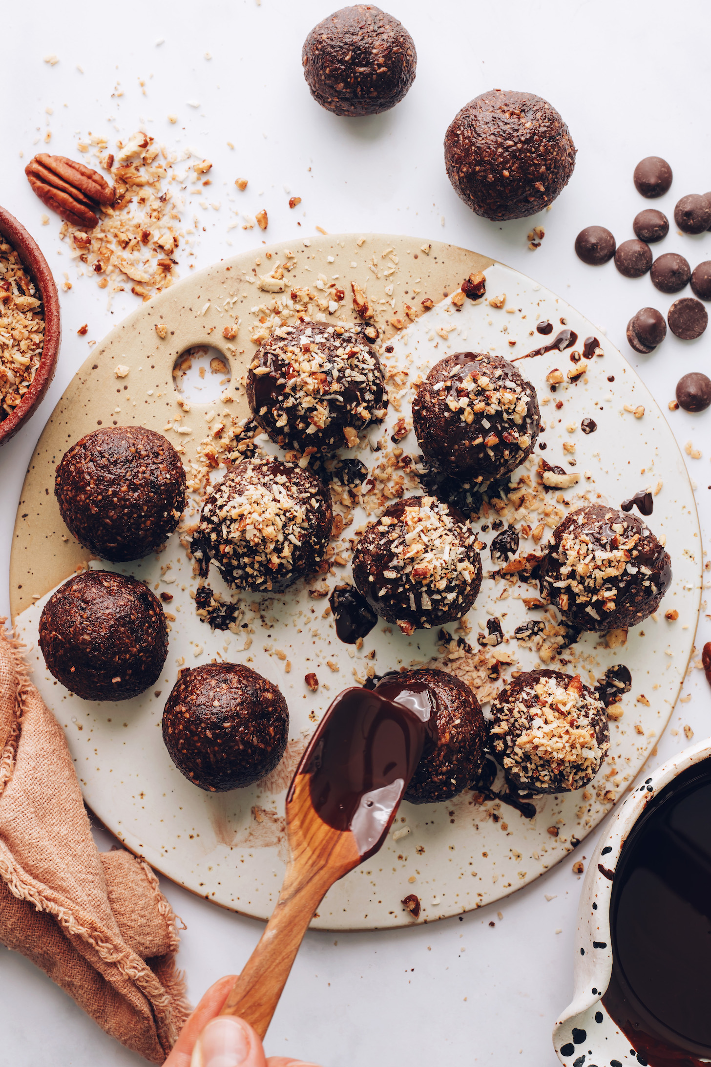 Drizzling melted chocolate onto energy bites