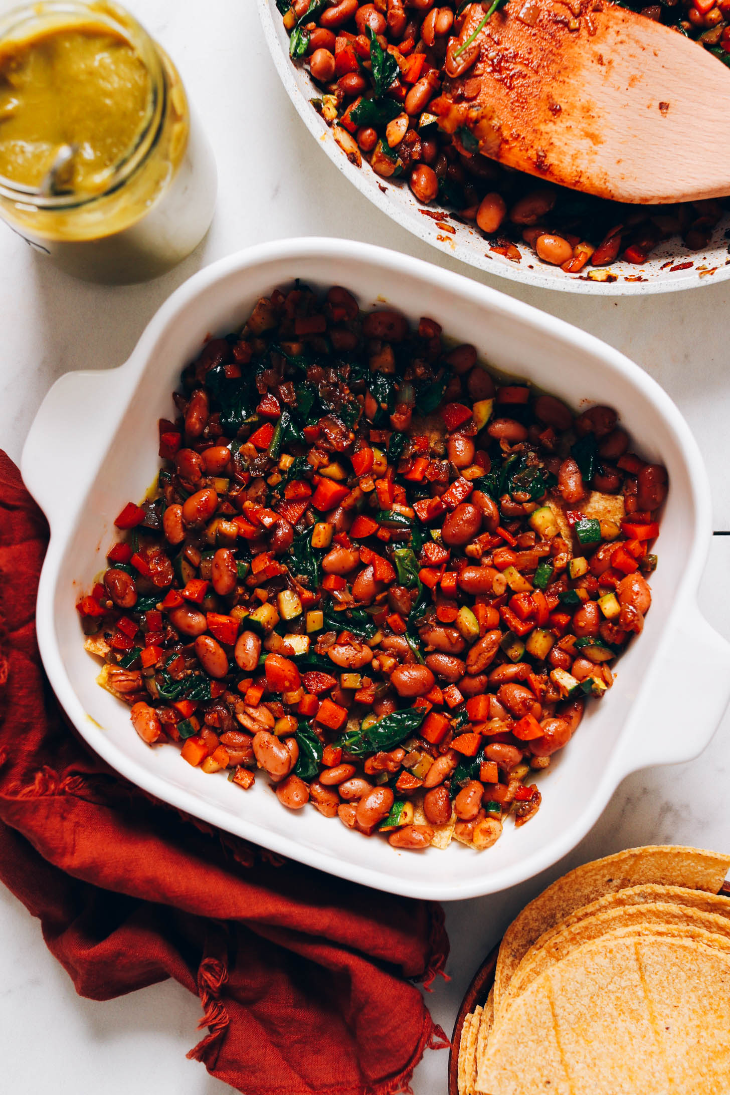 Bean and veggie filling over tortillas