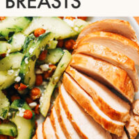 Plate of easy baked chicken breast with a salad on the side