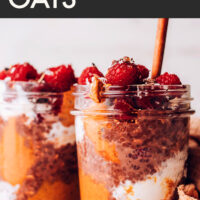Jar of vegan and gluten-free decadent chocolate overnight oats with raspberries on top