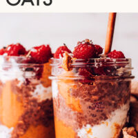 Jar of vegan and gluten-free decadent chocolate overnight oats with raspberries on top