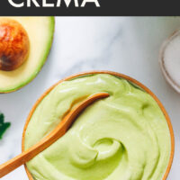 Spoon in a bowl of easy vegan avocado crema