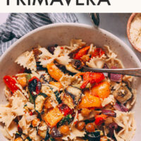 Bowl of vegan pasta primavera with roasted veggies