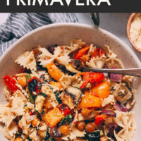 Bowl of vegan pasta primavera with roasted veggies