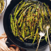 Cast iron skillet filled with spicy stir-fried green beans