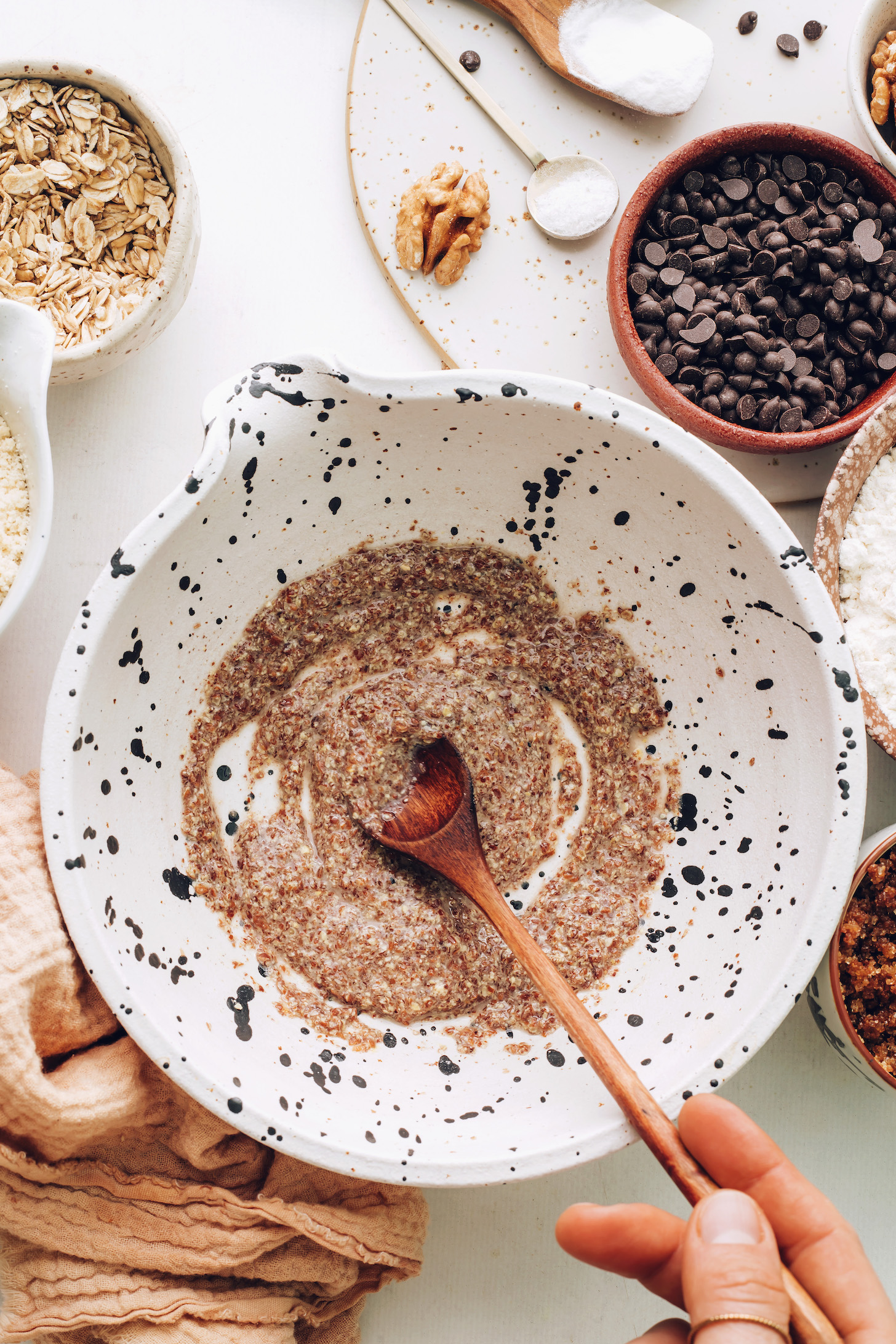 Mixing flaxseed meal and water in a bowl to make a flax egg