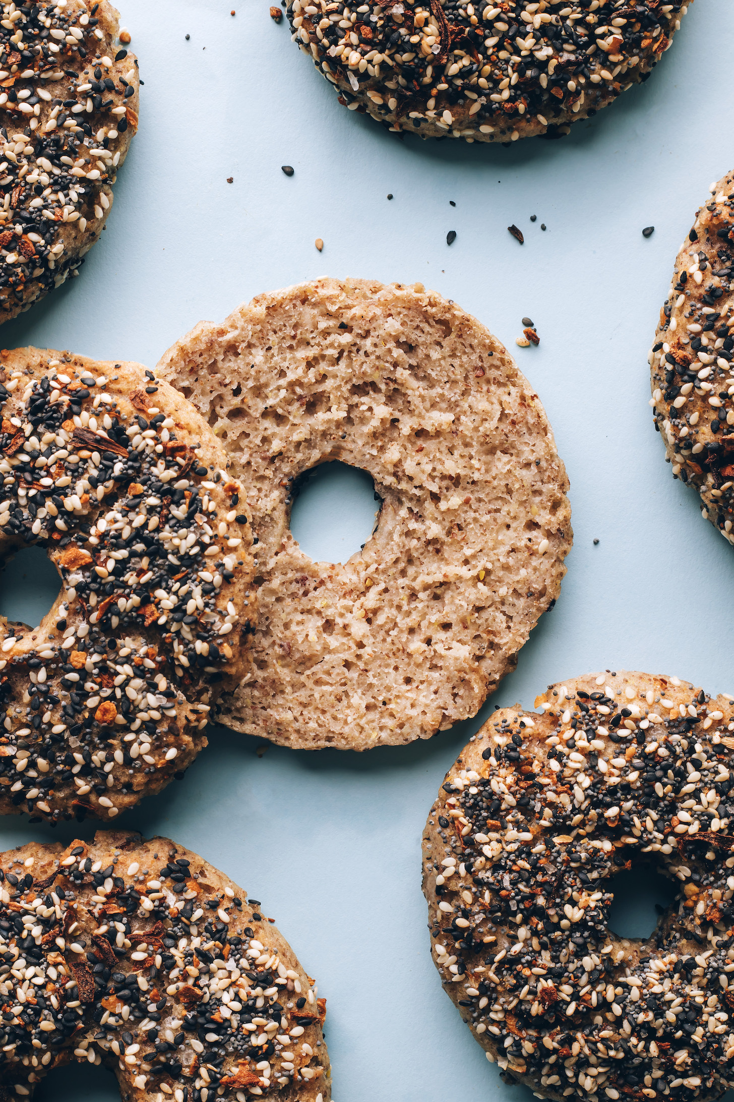 Gluten-free vegan everything bagels on a blue background