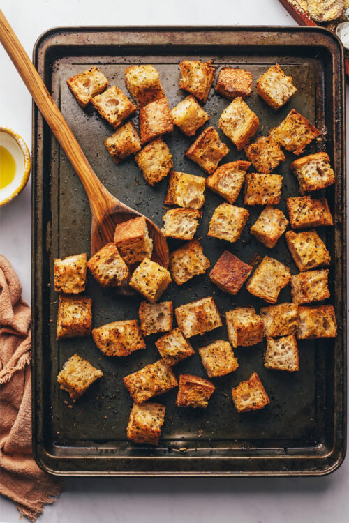Baking sheet of garlicky homemade croutons