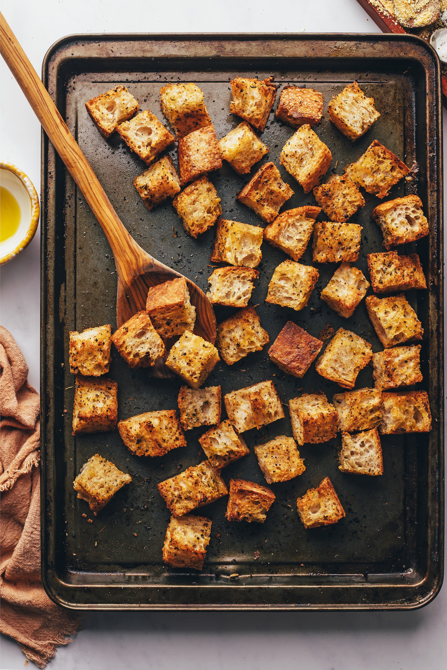 Homemade crispy croutons on a baking sheet