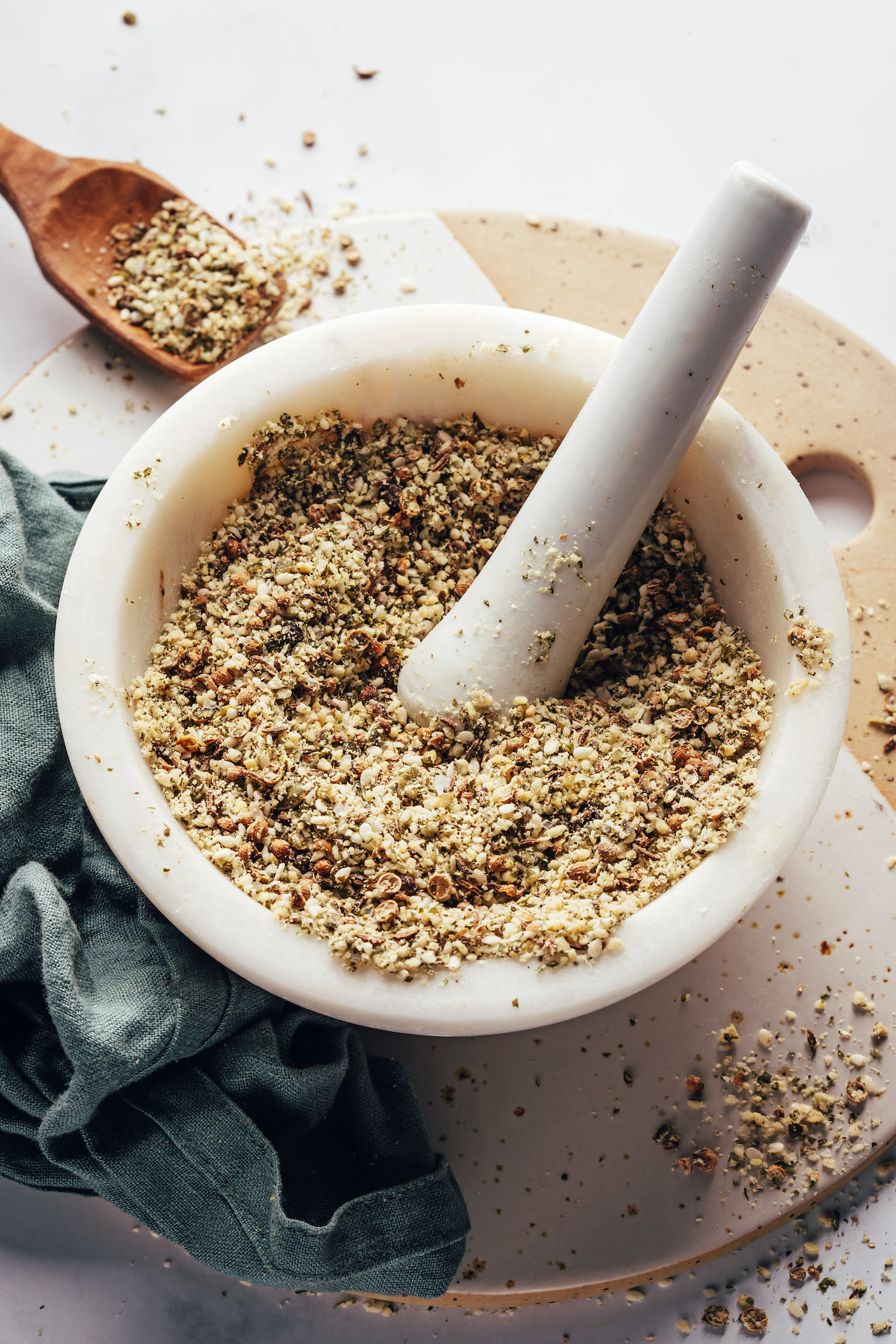 Homemade pumpkin seed dukkah seasoning in a mortar with pestle