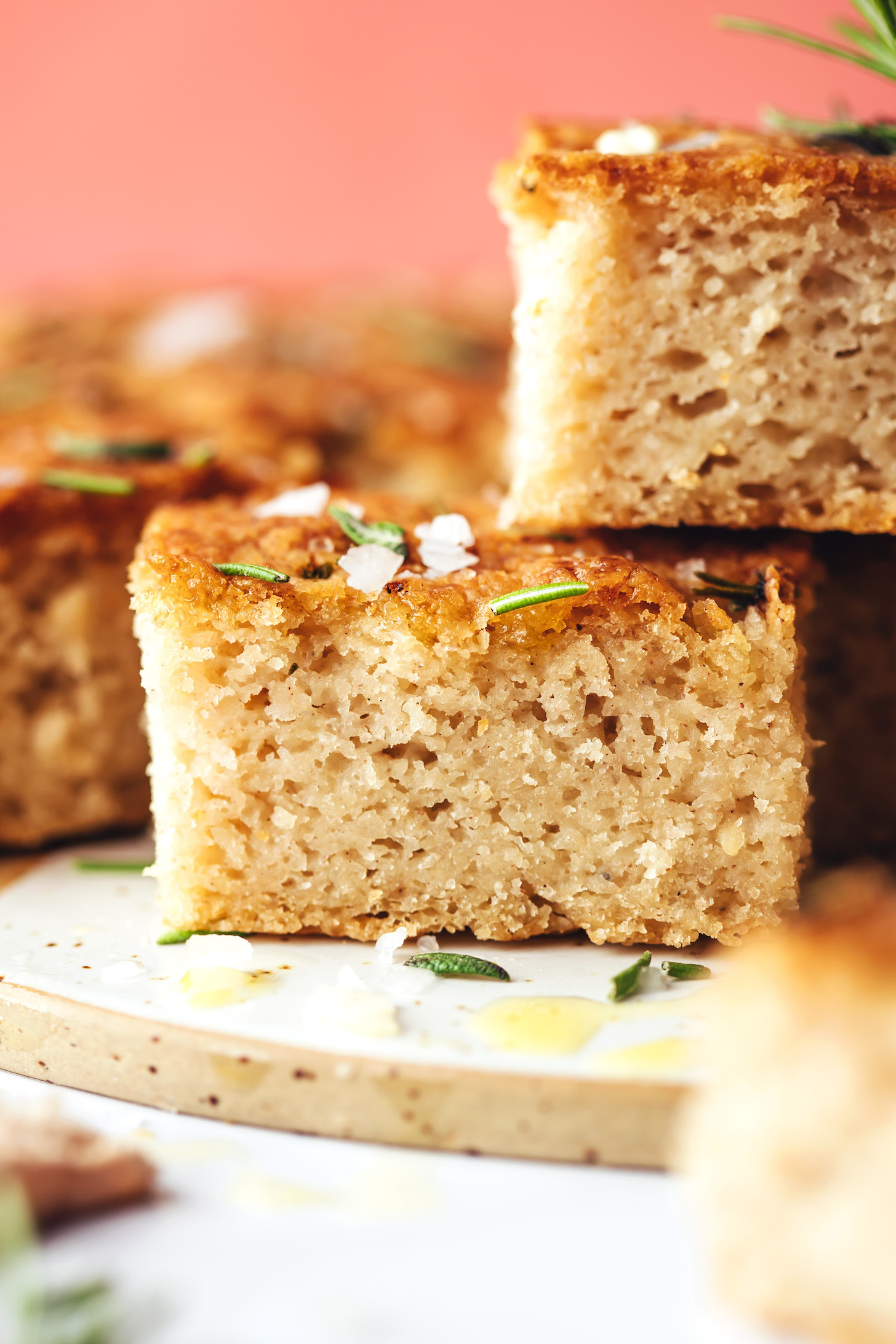 Two slices of gluten-free focaccia bread in a staggered stack
