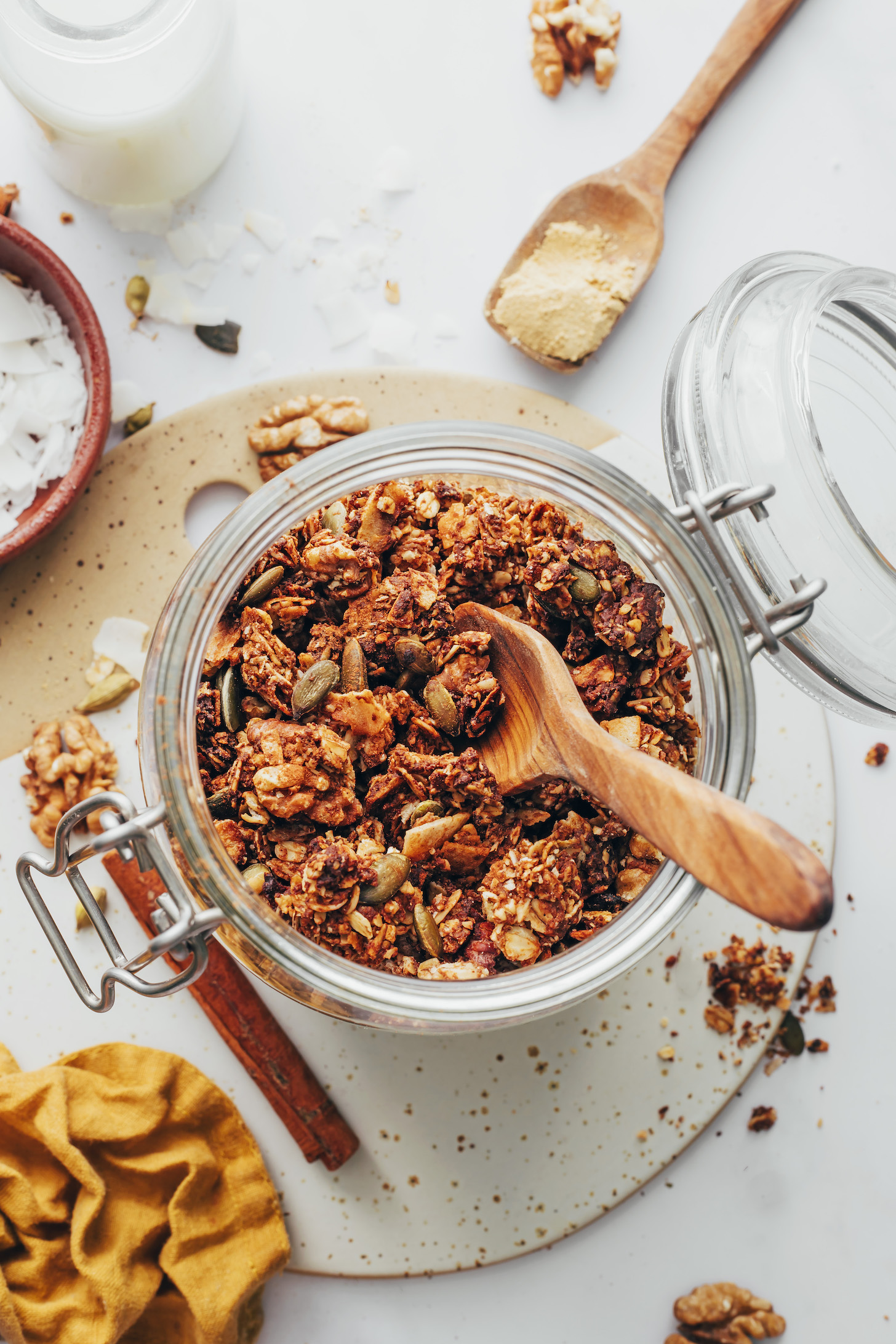 Small wooden spoon in a jar of chai granola