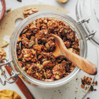 Top down shot of an open jar of chai granola