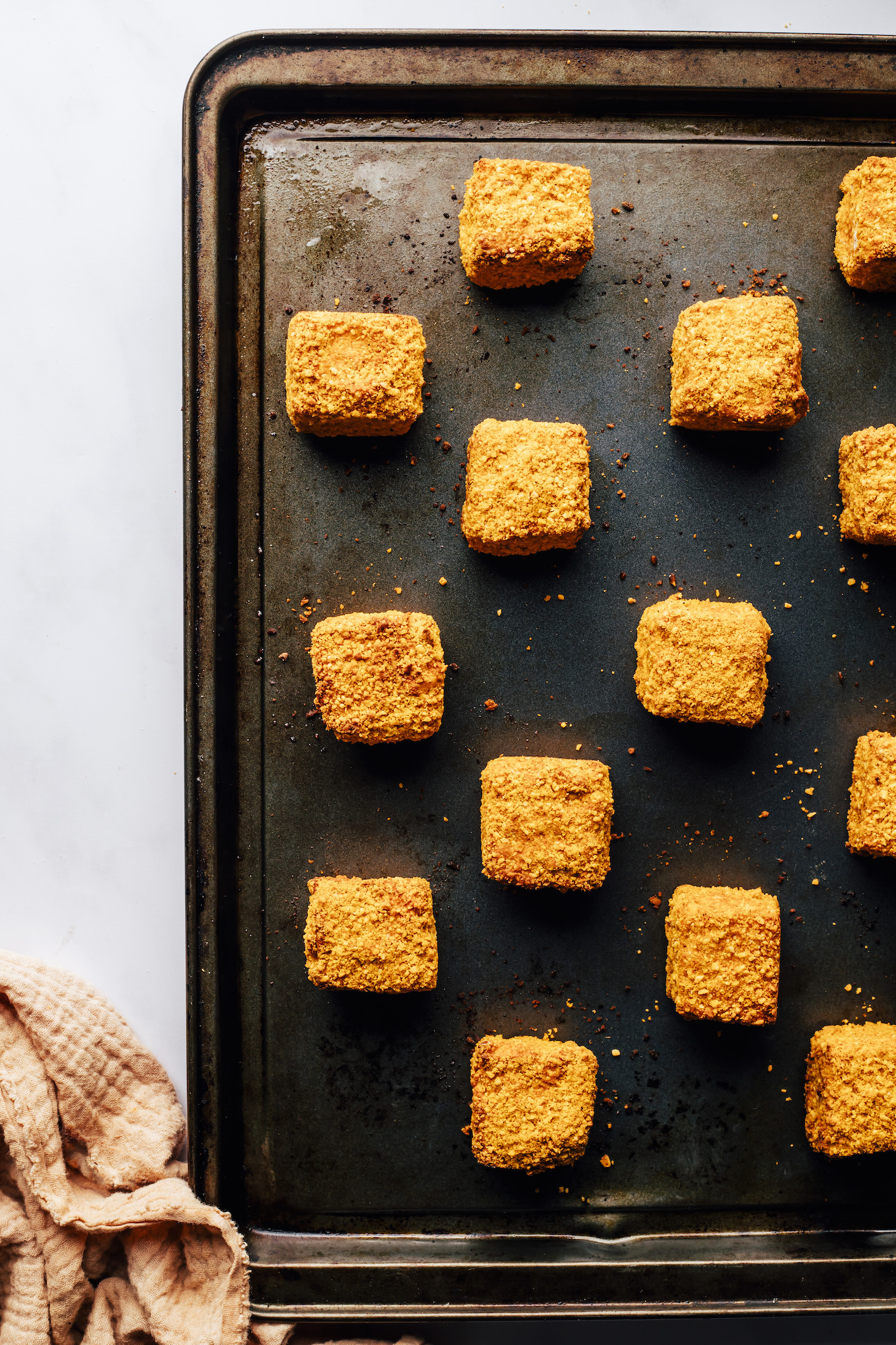 Cubed baked tofu breaded with a cashew coating