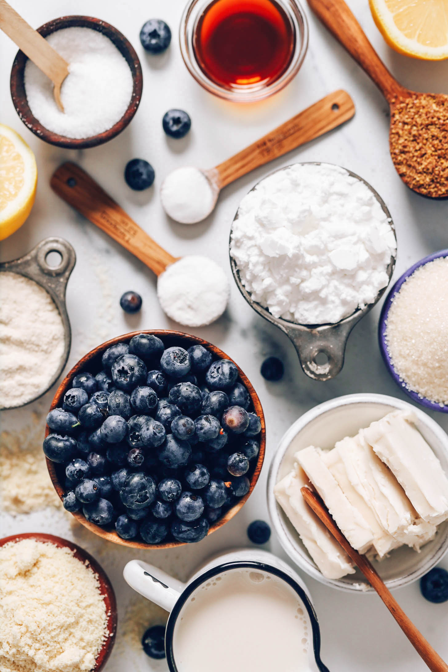 Flaxseed meal, lemon, vanilla, baking soda, baking powder, salt, brown rice flour, potato starch, blueberries, almond flour, dairy-free milk, vegan butter, and cane sugar