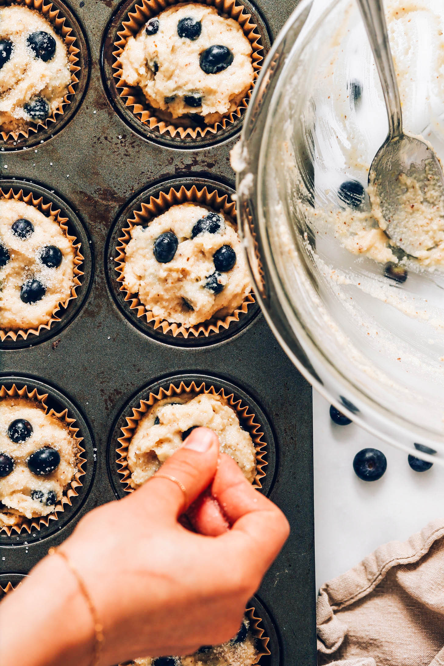 Adding fresh blueberries to gluten-free muffin batter