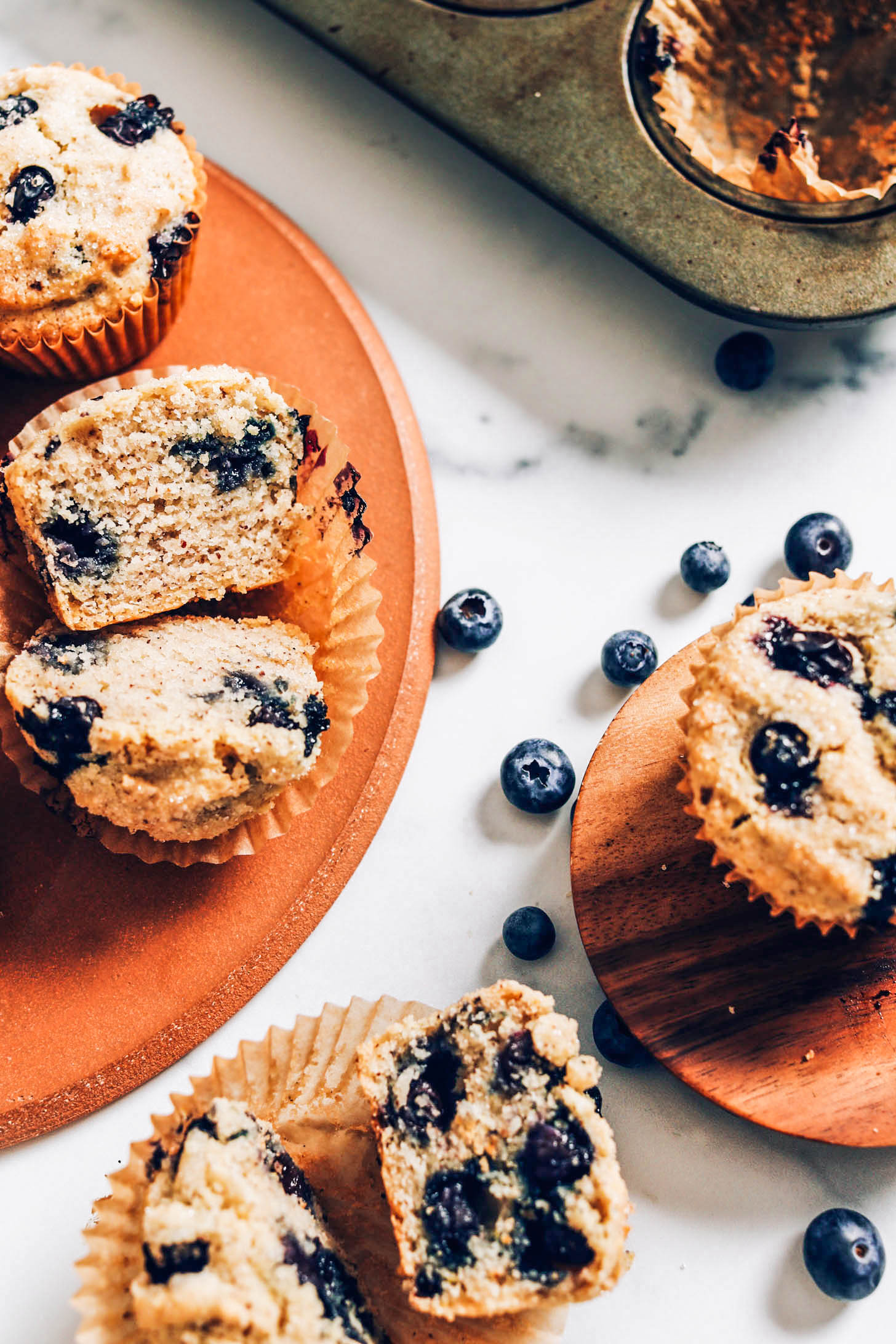 Blueberry muffins sliced open to show the inner texture