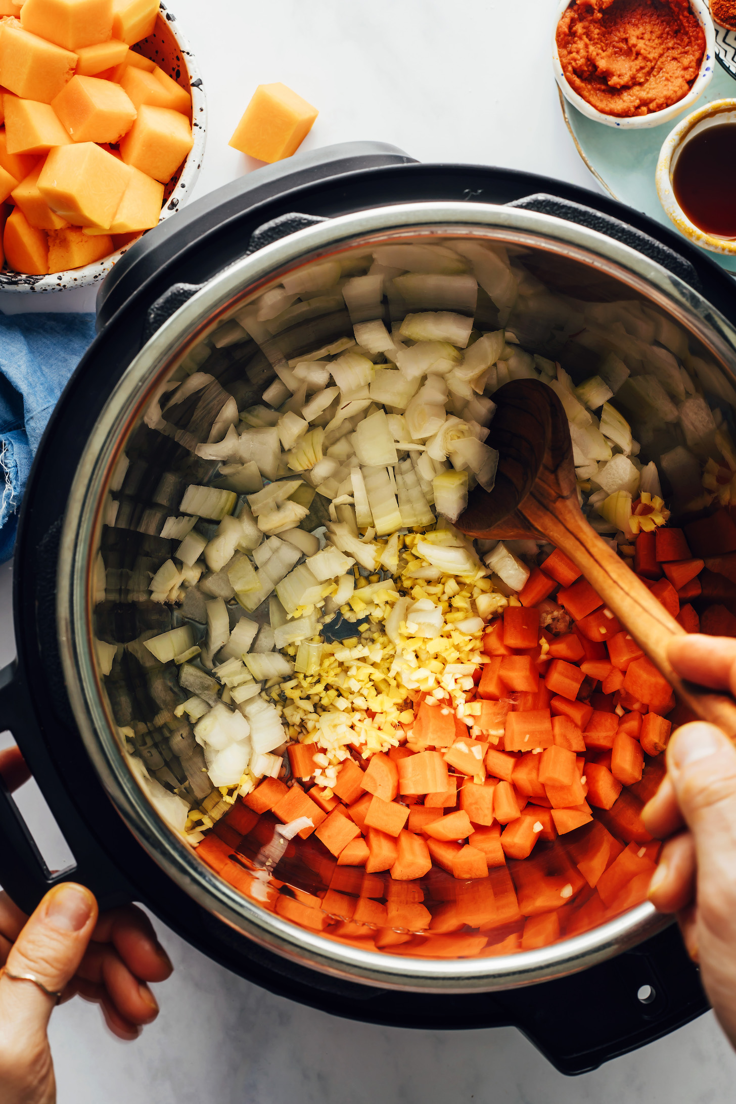 Sautéing onion, garlic, ginger, and carrots in the Instant Pot