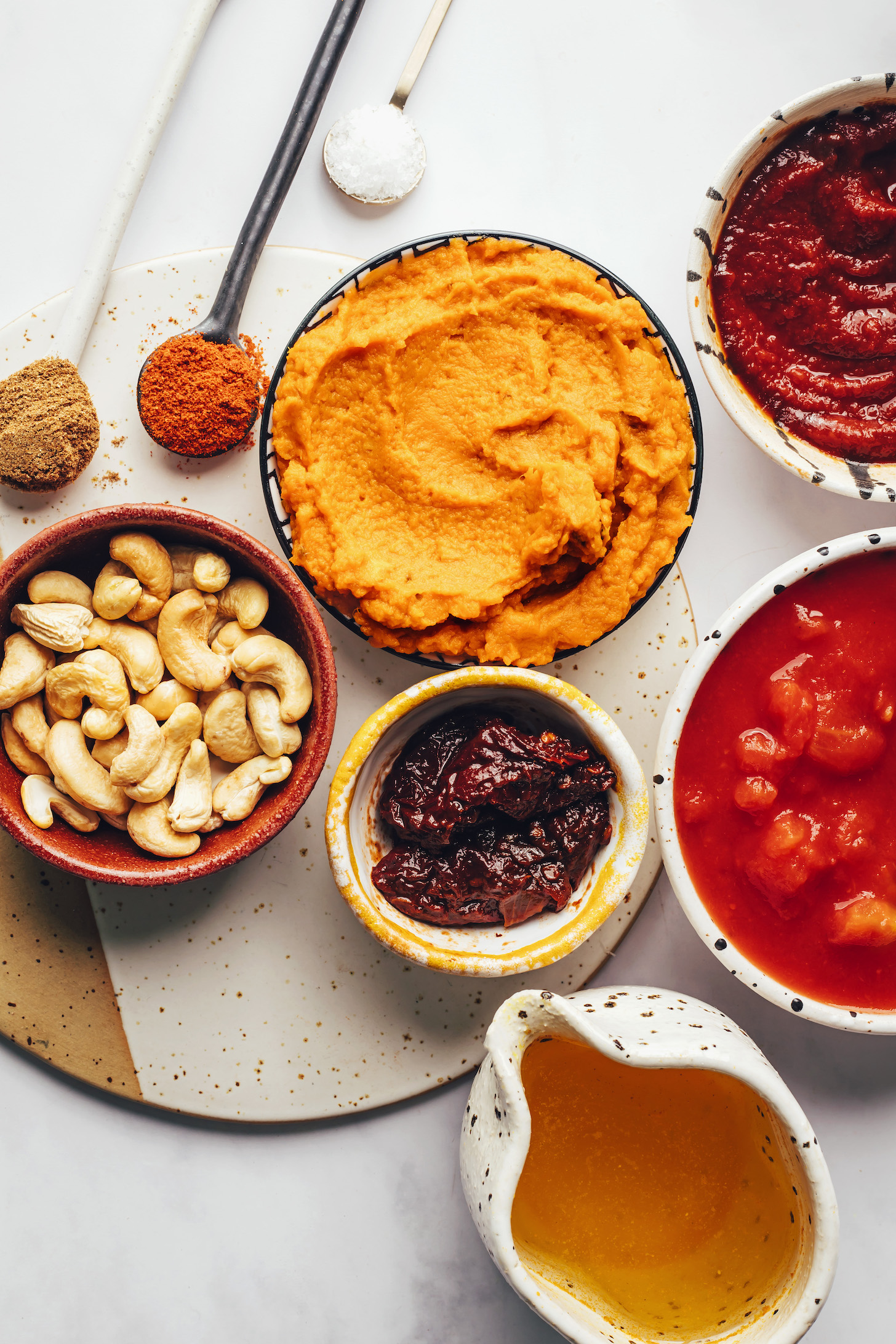 Spices, salt, adobo sauce, tomatoes, vegetable broth, chipotle peppers, pumpkin purée, and cashews