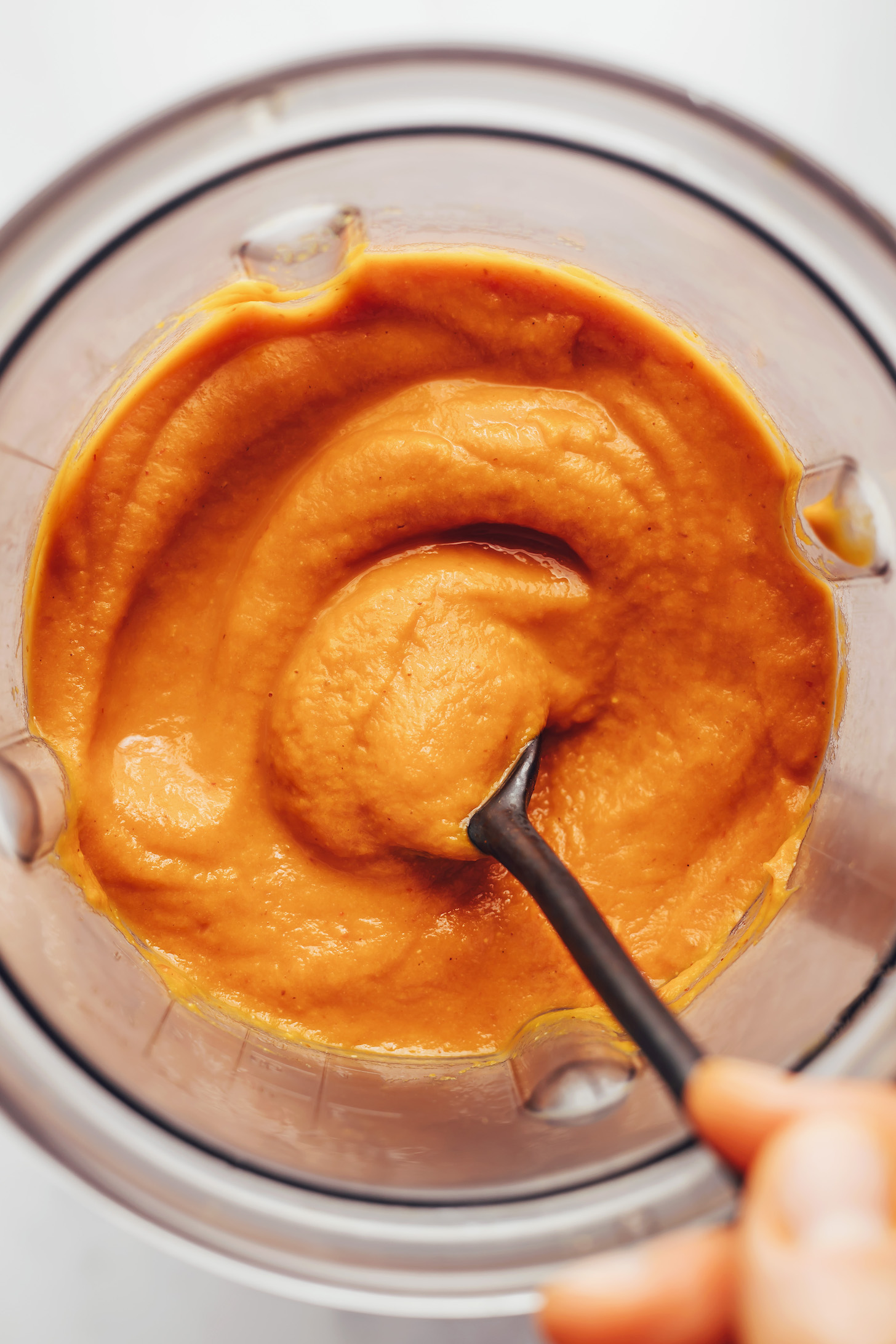 Creamy pumpkin enchilada sauce in a blender
