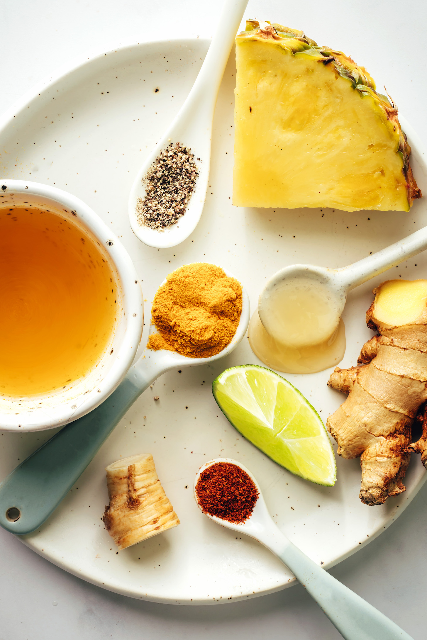 Pineapple, black pepper, apple cider vinegar, turmeric, horseradish, cayenne, lime, ginger, and honey