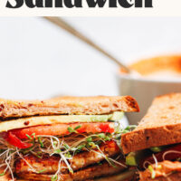 Vegan BLT-inspired sandwich with text above it saving Chipotle Hummus Sandwich with Smoky Tempeh Bacon