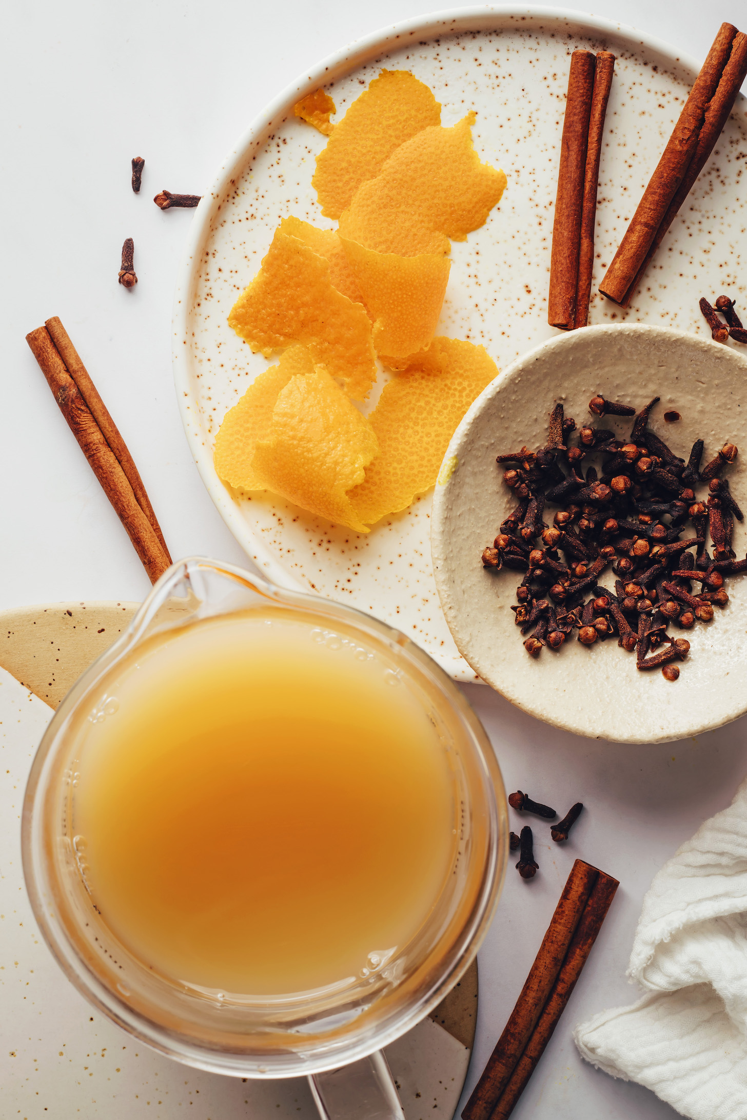 Apple cider, orange peel, cinnamon sticks, and cloves