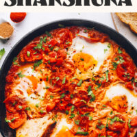 Pan of our easy shakshuka recipe with a slice of bread