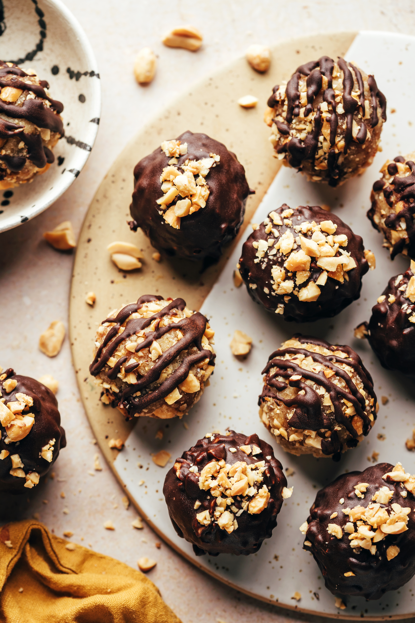 Top down shot of snickers energy bites coated with and drizzled with melted chocolate