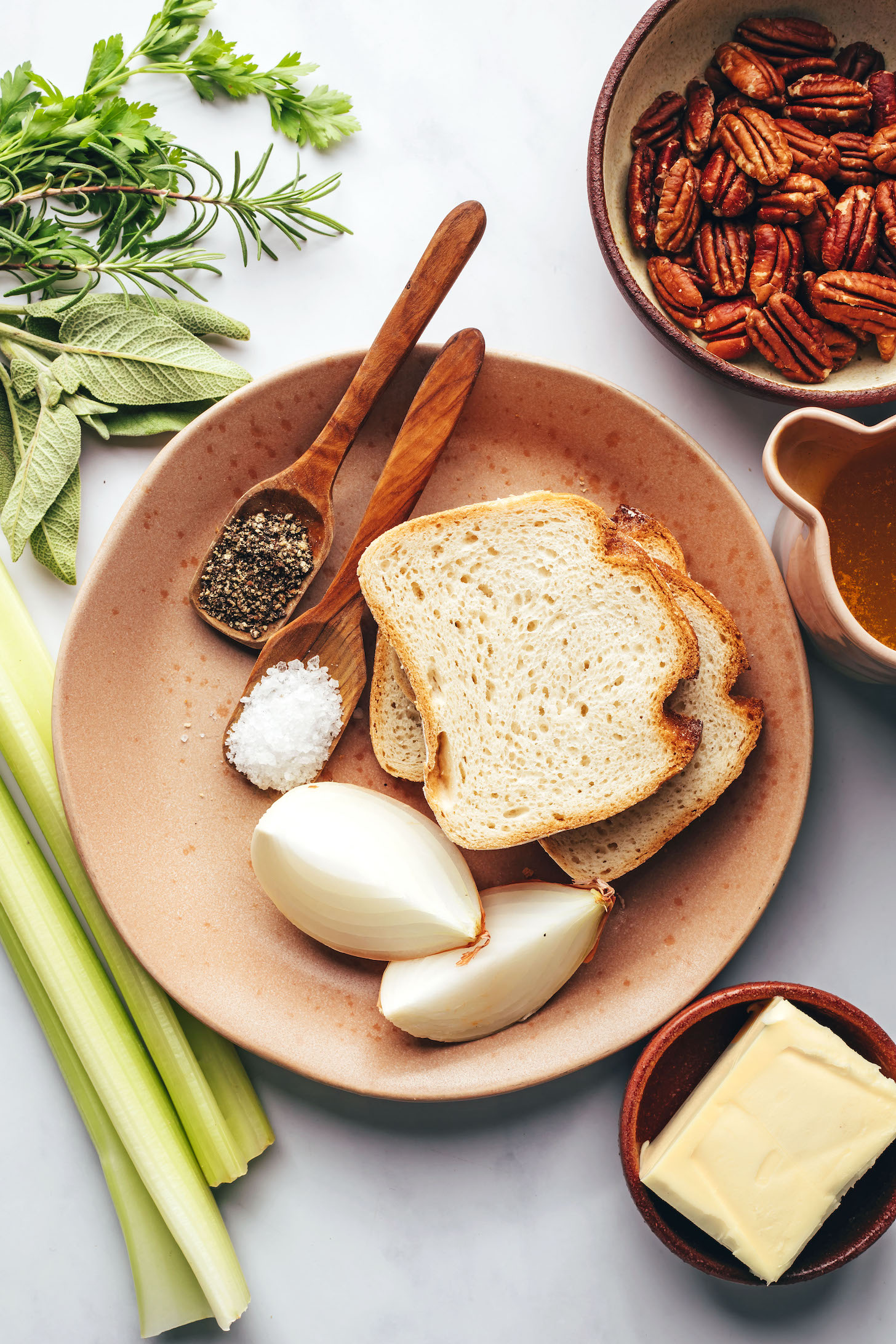 Celery, herbs, salt, pepper, gluten-free bread, onions, pecans, broth, and vegan butter