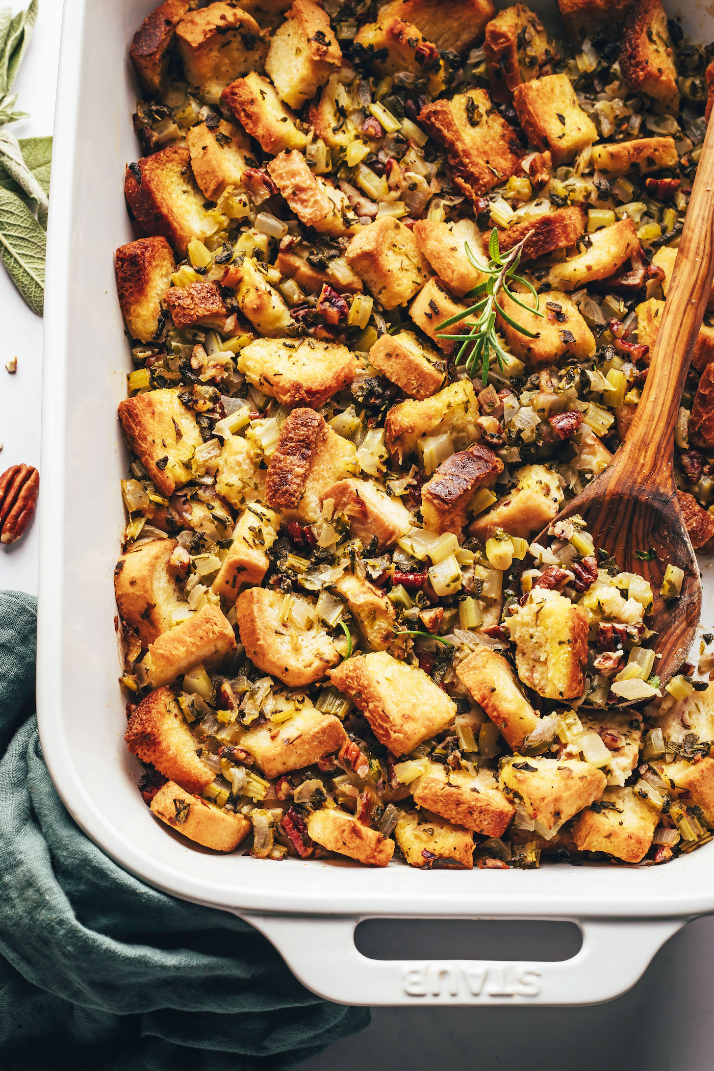 Wooden spoon in a pan of homemade vegan gluten-free stuffing
