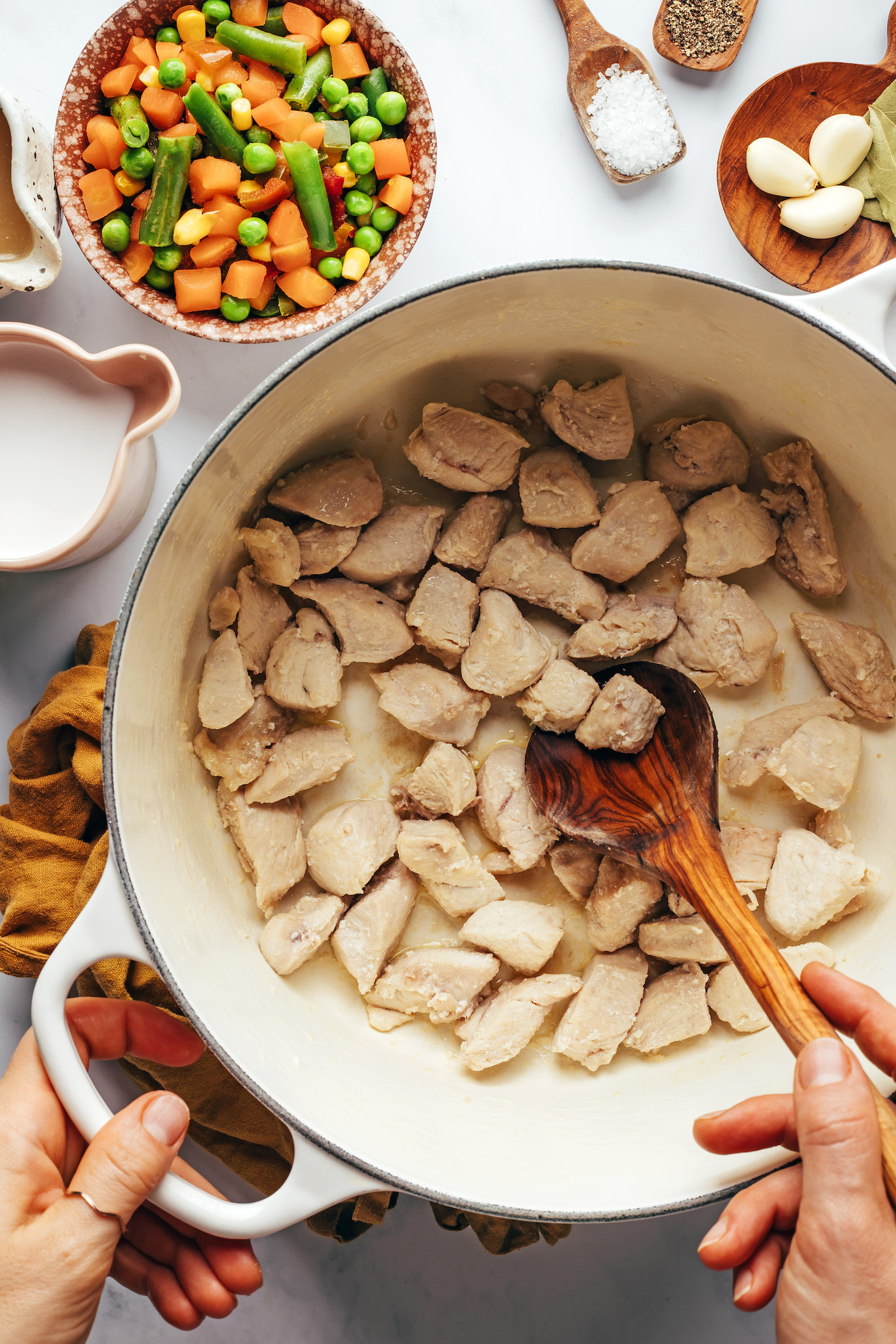 Cooking cubed chicken breasts in a Dutch oven