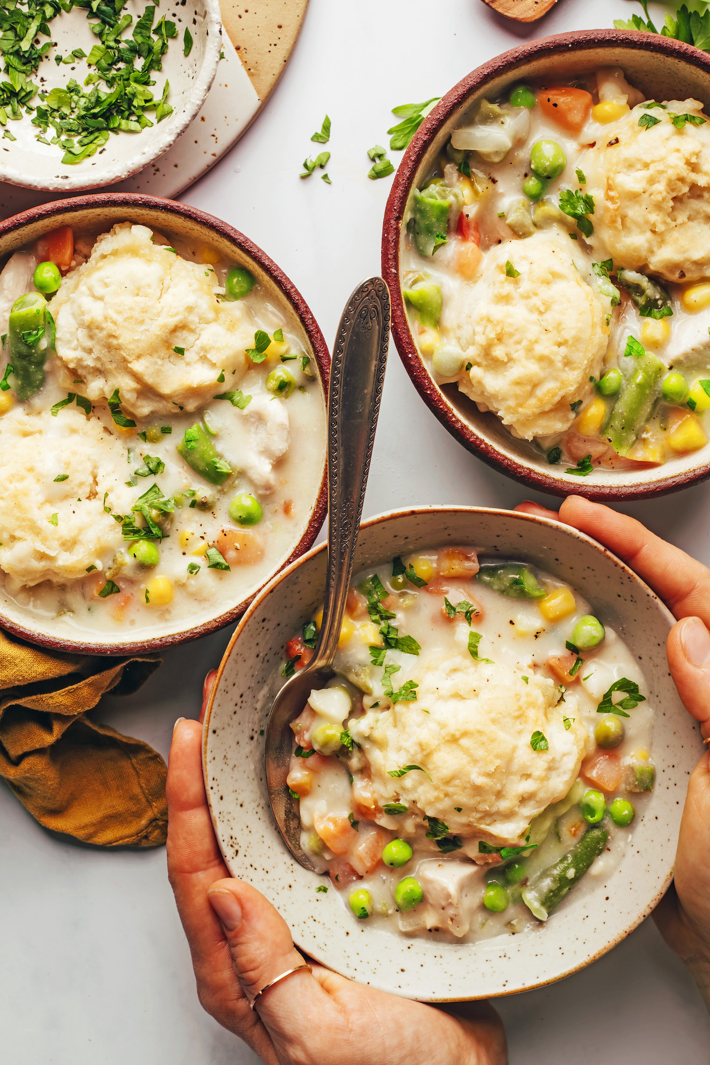 Overhead shot of three bowls of chicken pot pie soup