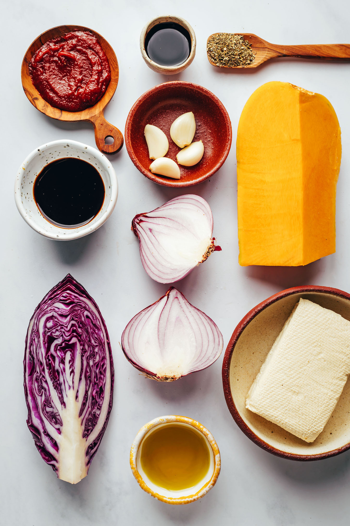 Tomato paste, balsamic vinegar, red cabbage, olive oil, red onion, garlic, tamari, Italian herb seasoning, butternut squash, and tofu