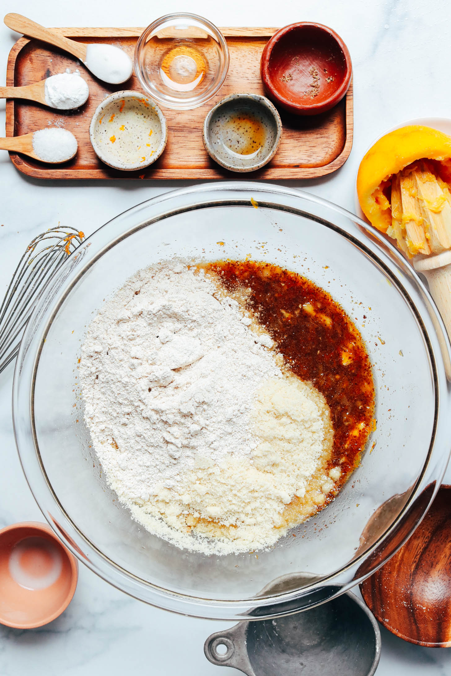 Wet and dry ingredients in a glass bowl