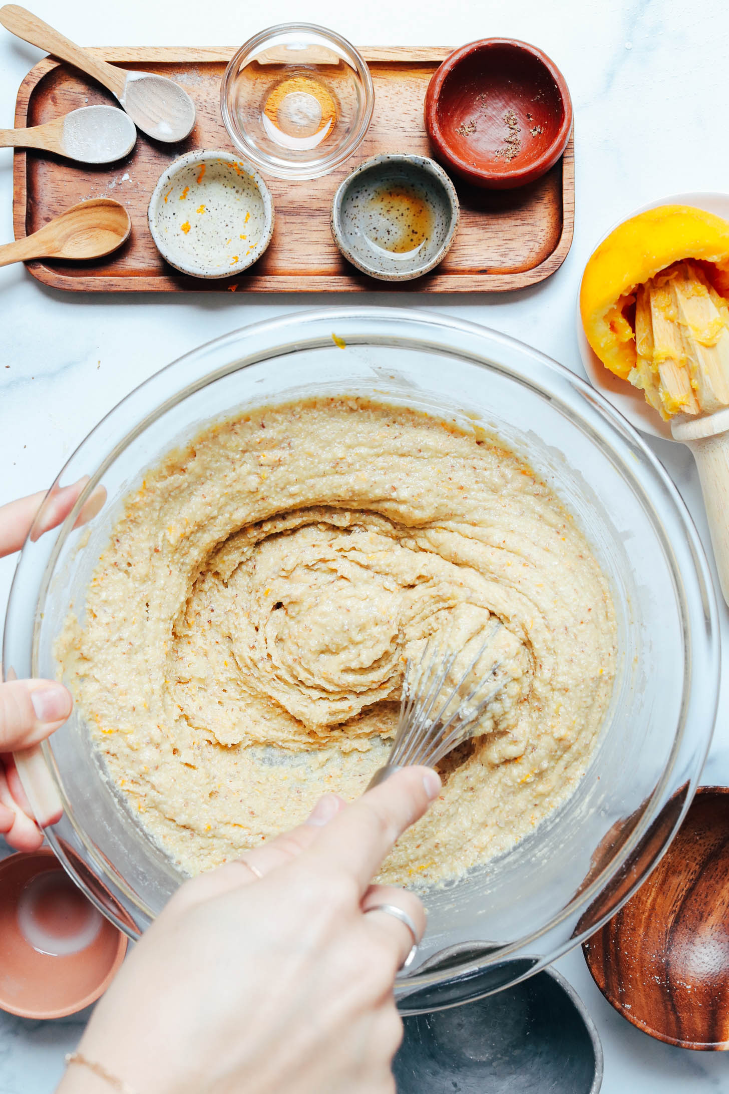 Whisking the muffin batter in a glass bowl