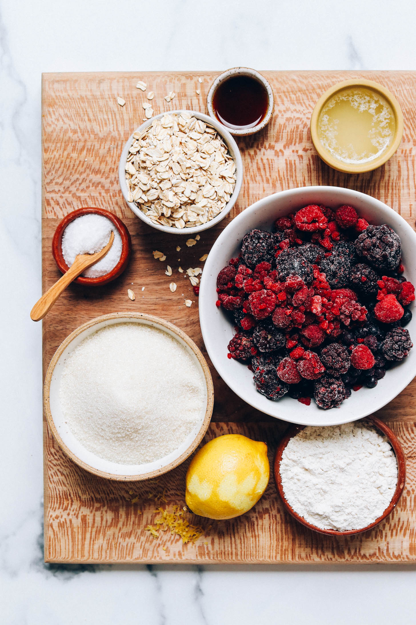Cane sugar, salt, oats, vanilla, vegan butter, mixed berries, gluten-free flour blend, and a lemon