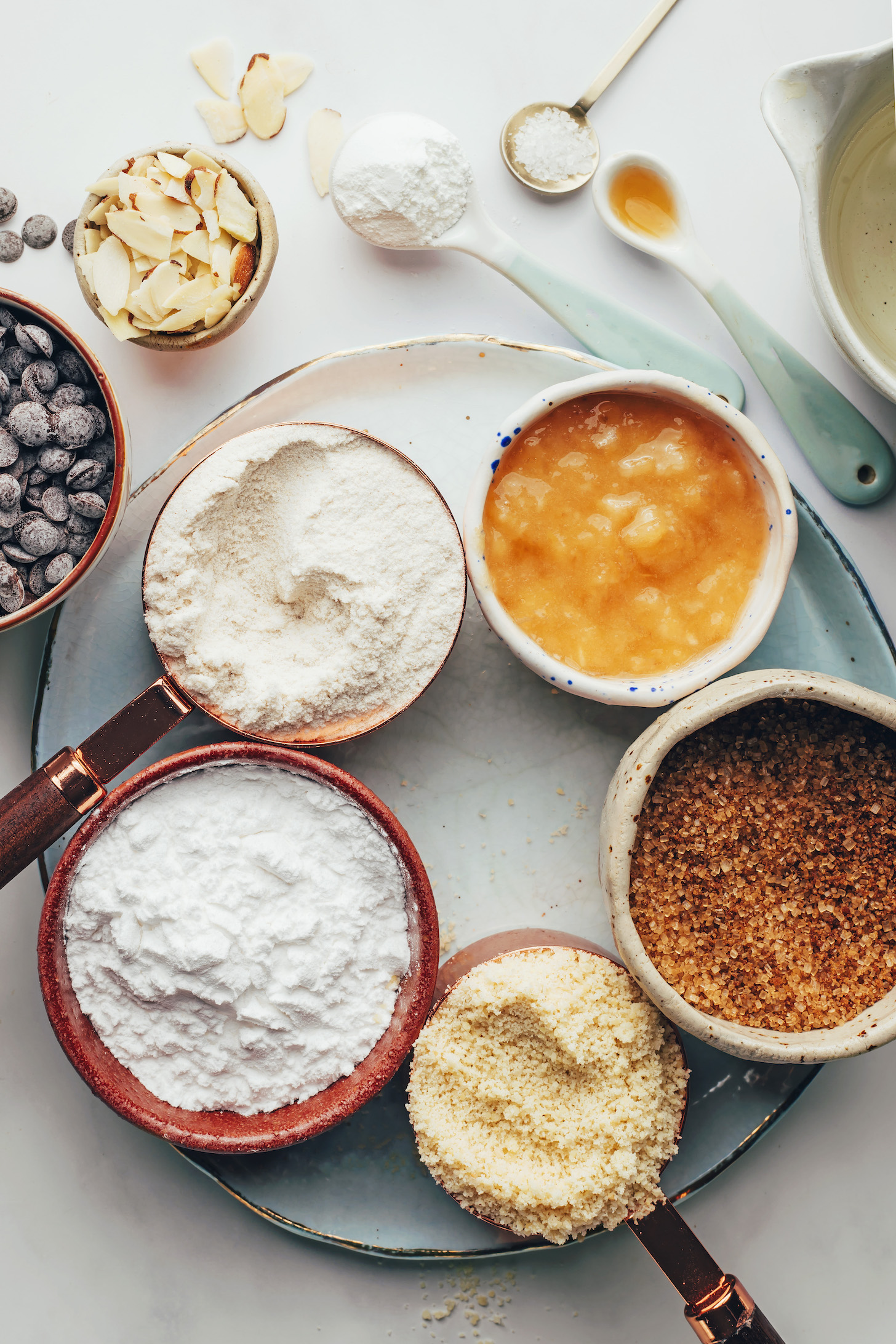 Chocolate chips, sliced almonds, baking powder, salt, almond extract, applesauce, cane sugar, almond flour, tapioca starch, and brown rice flour