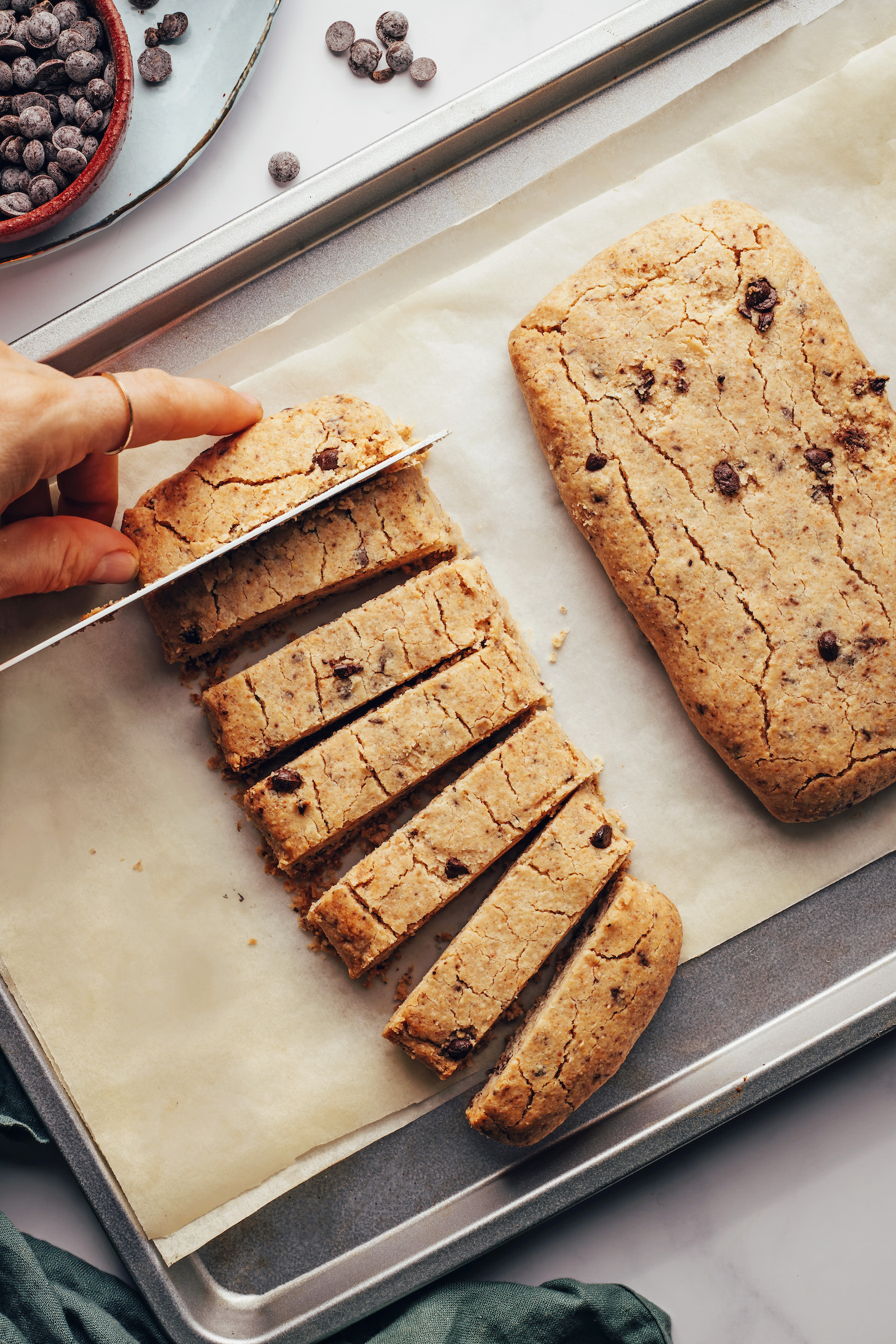 Slicing par-baked biscotti dough