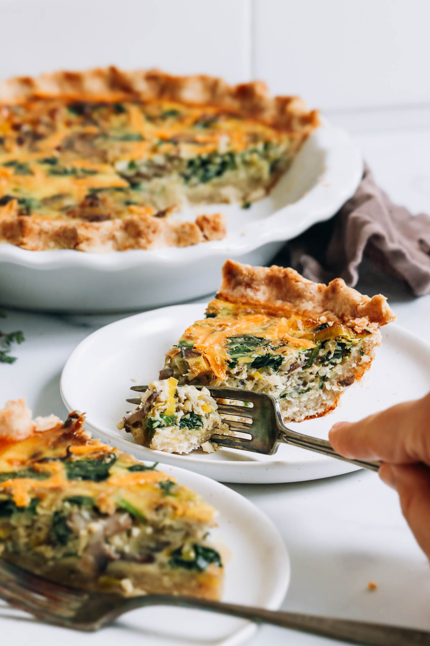 Using a fork to slice into a piece of our gluten-free dairy-free quiche recipe
