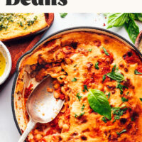 Pan of cheesy vegan pizza beans