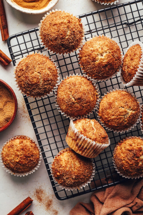 Vegan gluten-free cinnamon muffins on a cooling rack
