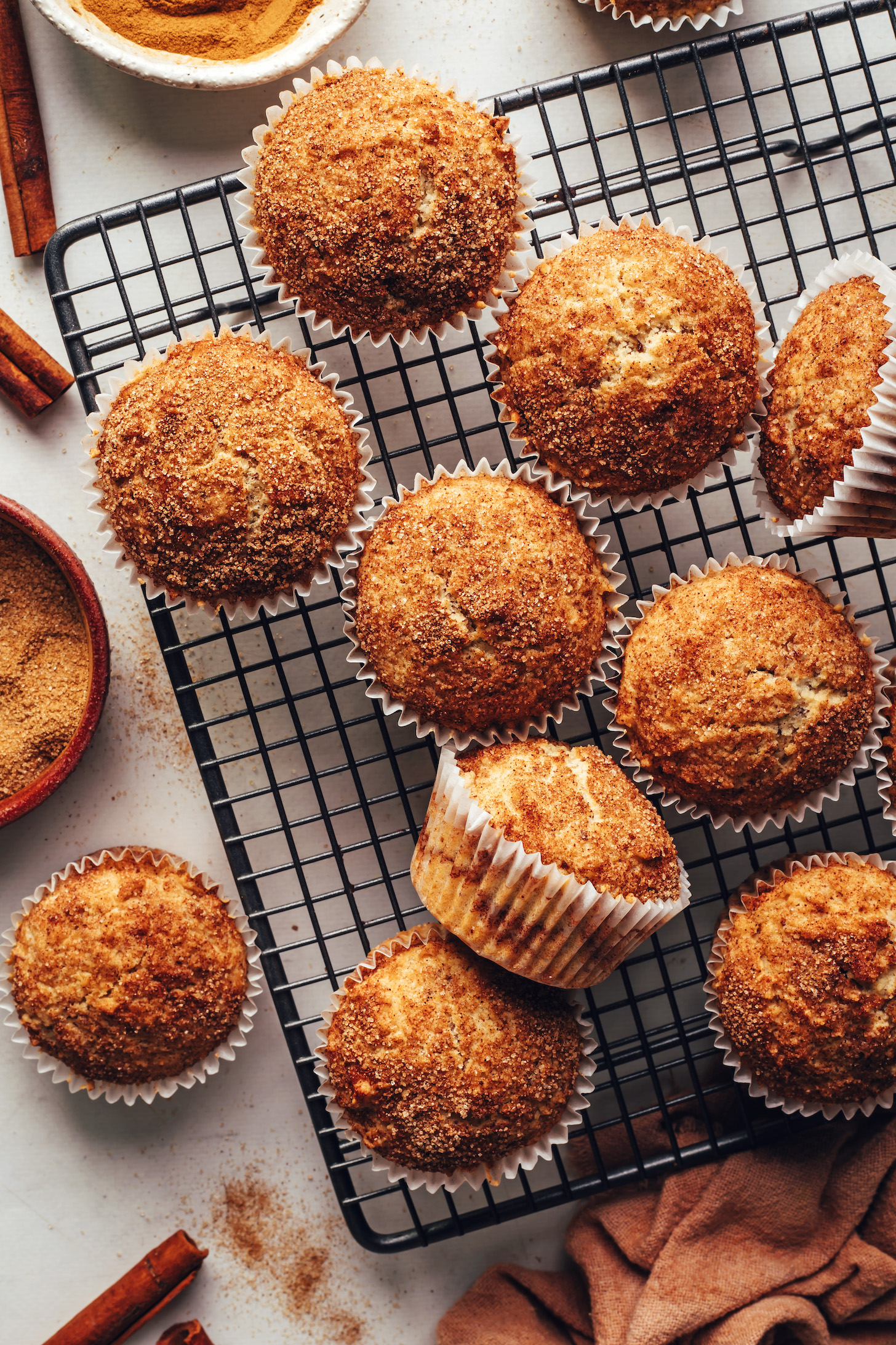 Freshly baked cinnamon sugar muffins on a cooling rack