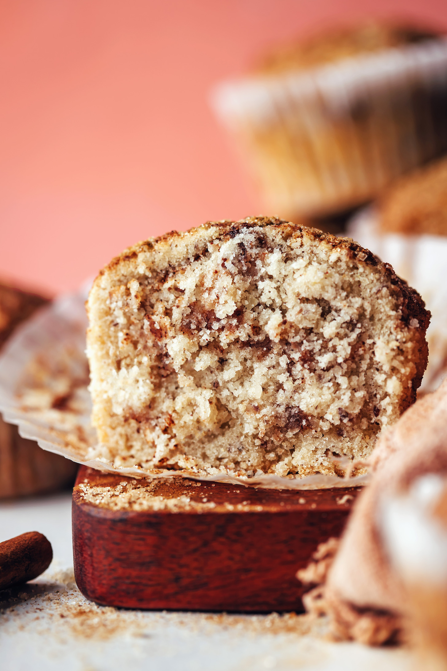 Muffin cut open to show the swirls of cinnamon on the inside